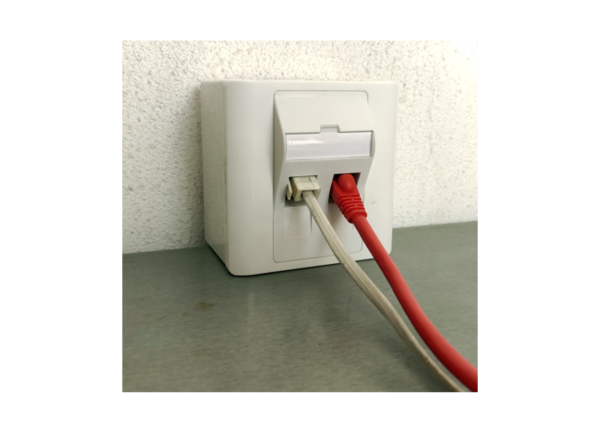 Illustrative image of cables entering a mounted 2 port shuttered keystone faceplate KP45K2